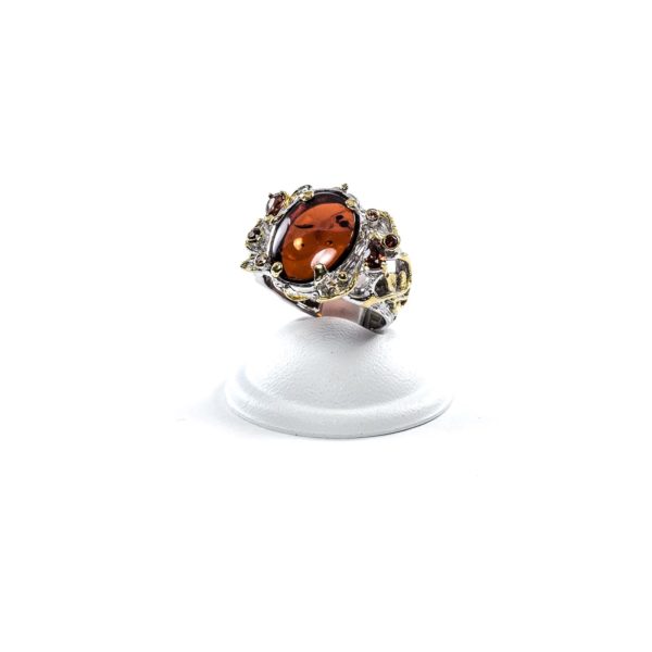 Spectacular ring with amber and garnet