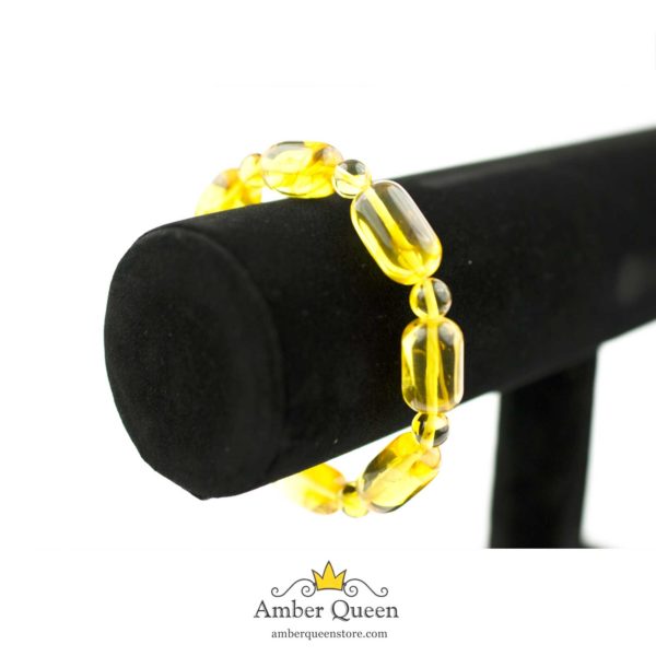 Yellow Transparent Amber Bracelet with Inclusions on Stand